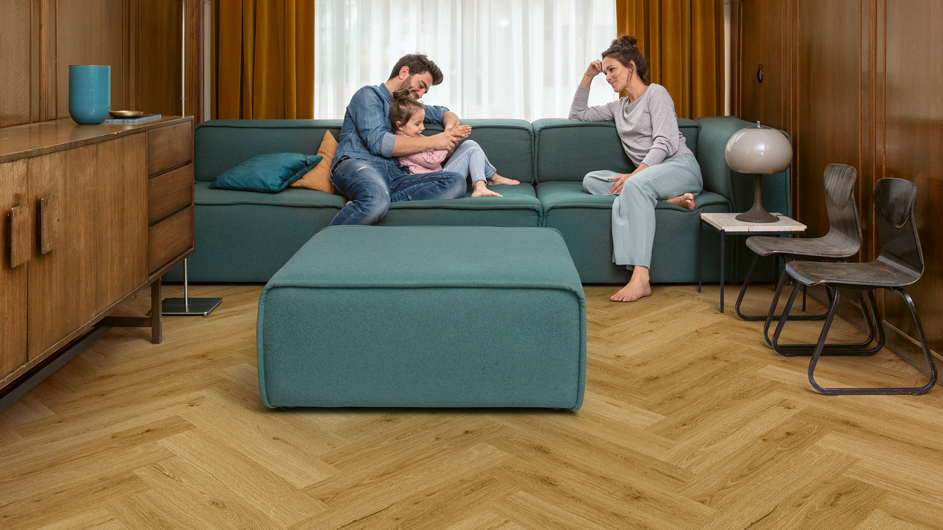 Living room with brown vinyl herringbone floor
